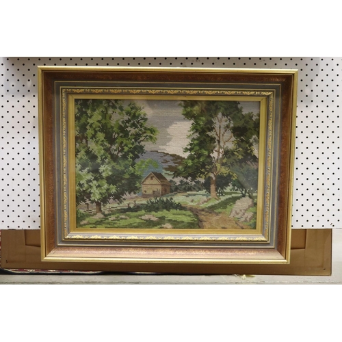 805 - Framed needlework of a cottage in a mountainous scene, approx 31cm x 43cm