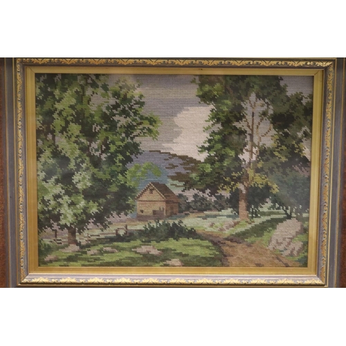 805 - Framed needlework of a cottage in a mountainous scene, approx 31cm x 43cm