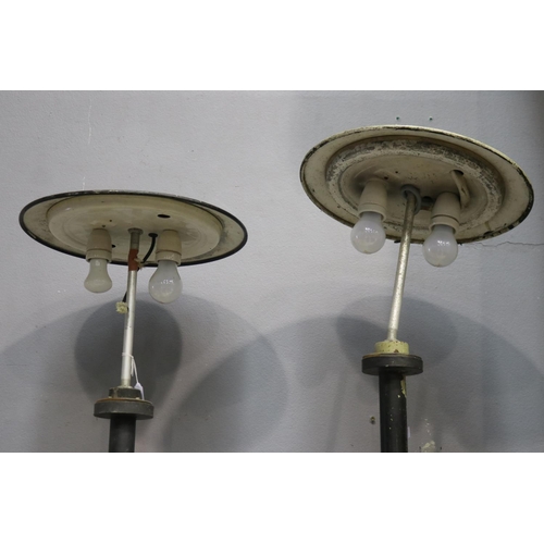 842 - Two industrial design iron lampposts, unknown working condition, approx 210cm H and shorter (2)