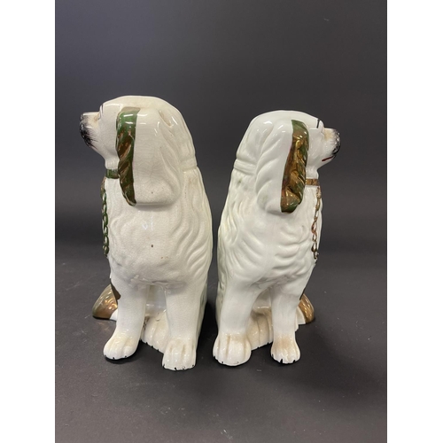 105 - Pair of Staffordshire dogs, approx  24cm H and shorter (2)
