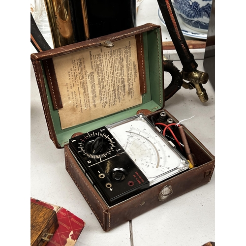136 - Vintage Multimeter in leather case, approx 9cm H x 21cm W x 15cm D