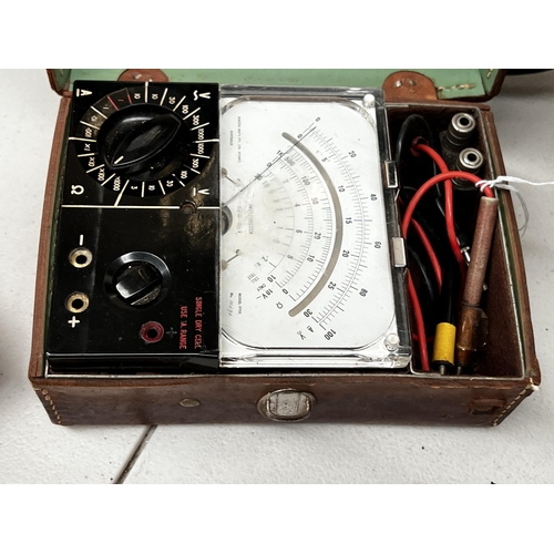 136 - Vintage Multimeter in leather case, approx 9cm H x 21cm W x 15cm D