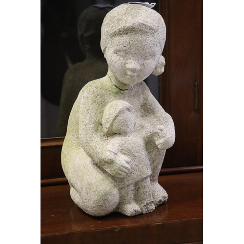 832 - Composite stone garden statue of girl with her dolly, approx 28cm H x 13cm W (AF)