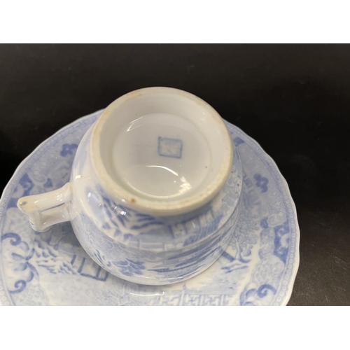 1053 - Two antique blue and white cups and saucers, one showing early mark. Purchased GL Auchinachie Woolla... 
