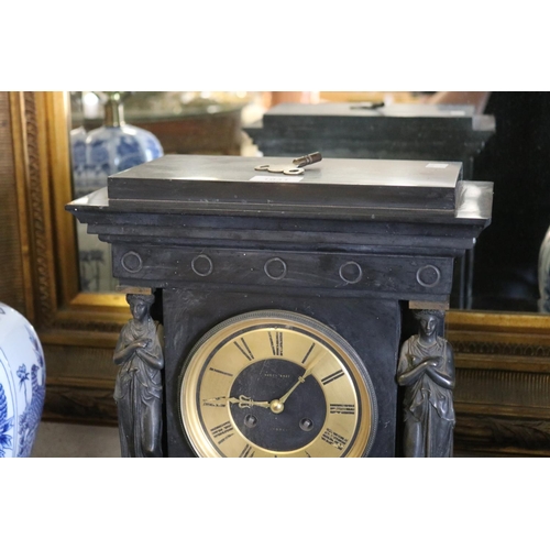 1041 - Large antique black slate mantle clock. Brass and ebonized dial engraved with Hardy Bros Sydney. The... 