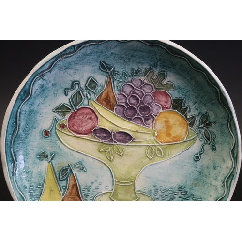 1059 - Francis Jones Studio Sydney, ceramic plate, decorated in raised slip with a comport of fruit, signed... 