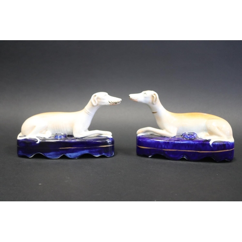 1061 - Pair of Staffordshire pottery recumbent dogs, approx 12cm H x 20cm L each (2)