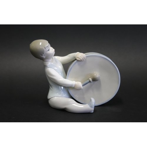 1063 - Lladro porcelain figure boy with bass drum, approx 12cm H x16cm W