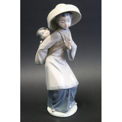 1067 - Lladro porcelain figure Japanese lady with young child on her back, approx 27cm H