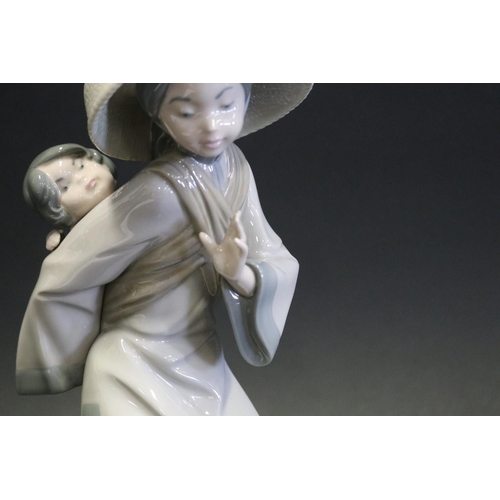 1067 - Lladro porcelain figure Japanese lady with young child on her back, approx 27cm H