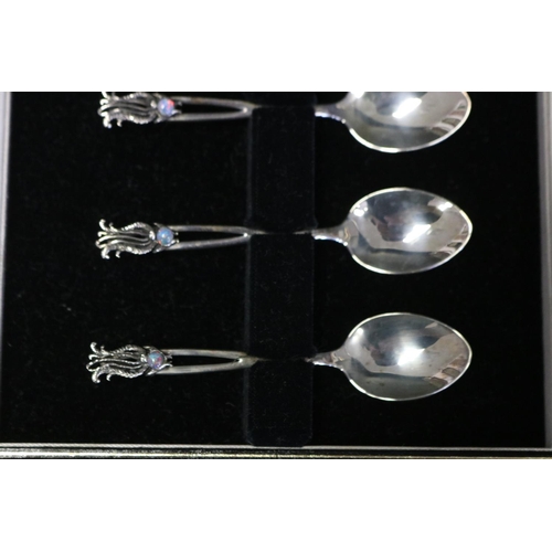 1080 - Cased set of six Australian Flynn sterling silver teaspoons mounted with opal, in the form of a lyre... 