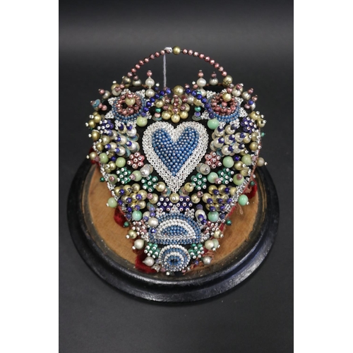 1027 - Antique 19th century soldiers or sailors heart shaped beadwork cushion under glass dome, A present f... 