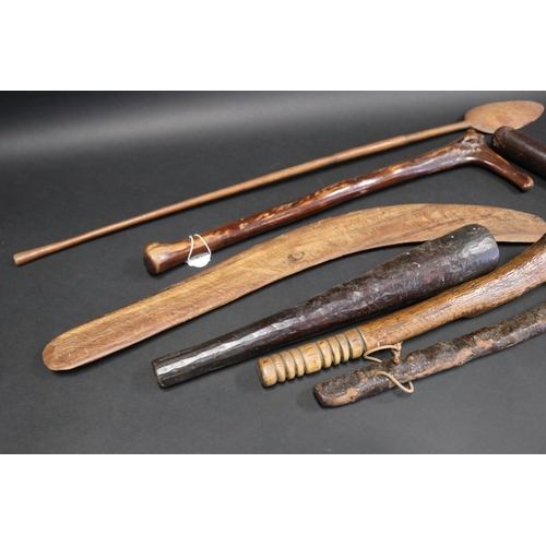 1029 - Good Selection of antique and later wooden weapons, to include a Boomerang, hand clubs, crude trunch... 