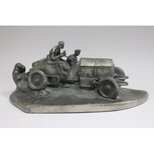 SHOULD READ - Unknown composition racing car desk piece, in the form of a speeding early open race car with driver and riding mechanic, the hinged hood revealing inkwell, mark to back, approx 19cm H x 40cm W x 24cm D