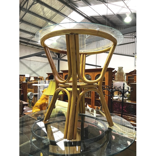 528 - Circular glass topped cane sun room table, approx 75cm H 75cm Dia