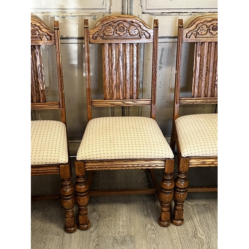 551 - Set of four American Oak turned leg dining chairs, to include one with arms  each with carved decora... 