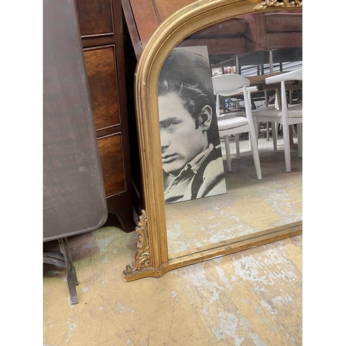 576 - Victorian style arched over mantle mirror, with applied decoration to the sides, approx 93cm H x 130... 