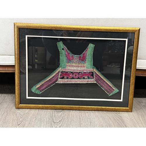 579 - Shadow framed antique Chinese child's textile piece, approx 44 cm x 28 cm