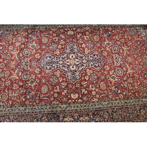 620 - Vintage Persian silk carpet, of predominately red ground, with all over floral pattern, approx 142cm... 