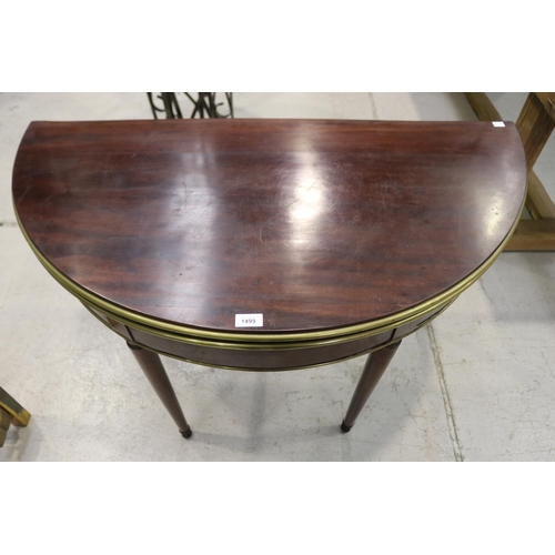 57 - Antique French mahogany D end fold over games table, with brass banded trim, standing on turned tape... 