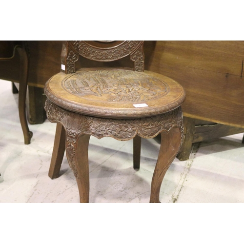 96 - Finely carved oak & teak Chinese salon chair. The front of the oval cameo back deeply carved with a ... 