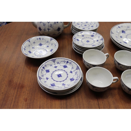 106 - Part Johnson Bros blue and white service to include teapot, plates, cups, saucers, etc, approx 28 pi... 