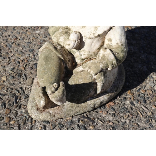 122 - Composite stone garden statue of little boy sitting with apple in hand, approx 31.5cm H