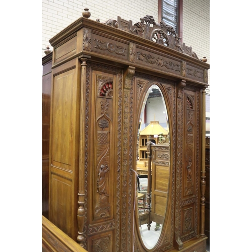 146 - Antique French Brittany three door armoire and three drawers below, carved in relief, approx 246cm H... 