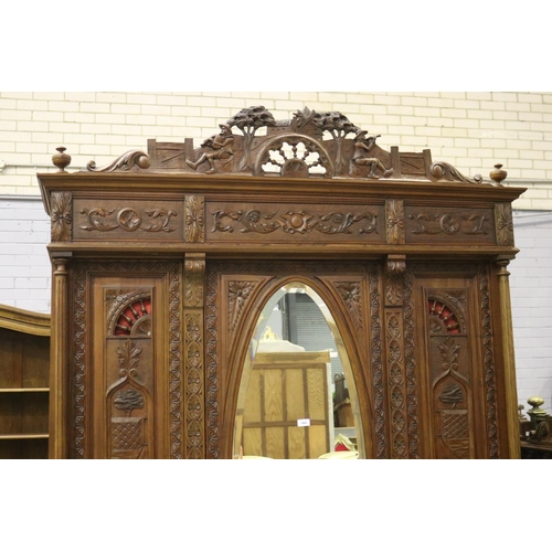 146 - Antique French Brittany three door armoire and three drawers below, carved in relief, approx 246cm H... 