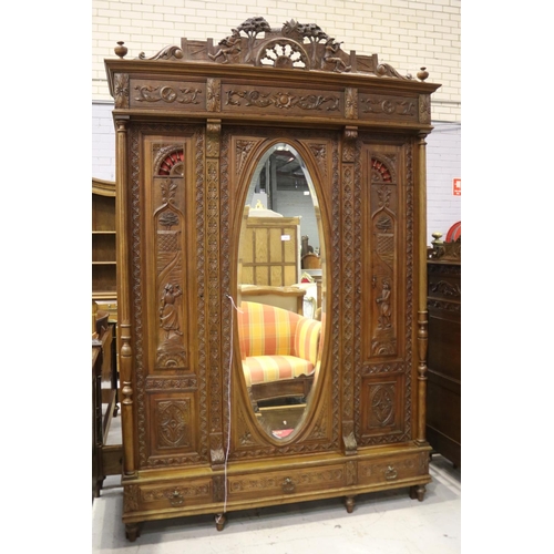 146 - Antique French Brittany three door armoire and three drawers below, carved in relief, approx 246cm H... 