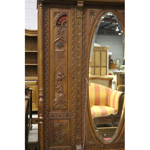 146 - Antique French Brittany three door armoire and three drawers below, carved in relief, approx 246cm H... 