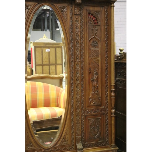 146 - Antique French Brittany three door armoire and three drawers below, carved in relief, approx 246cm H... 