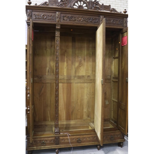 146 - Antique French Brittany three door armoire and three drawers below, carved in relief, approx 246cm H... 