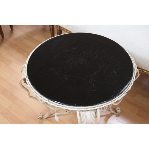 150 - Vintage French painted iron & black glass topped table, approx 54.5cm H x 62cm Dia