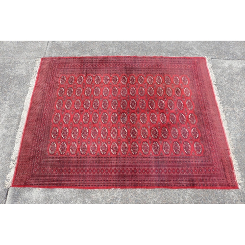 221 - Large fine handknotted wool red ground carpet, approx 352cm x 276cm