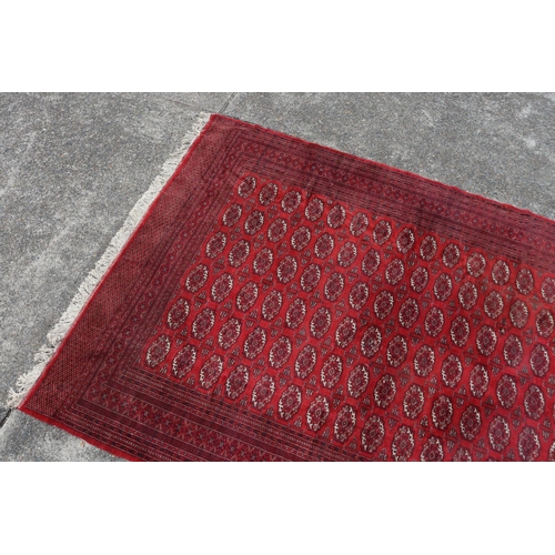 221 - Large fine handknotted wool red ground carpet, approx 352cm x 276cm