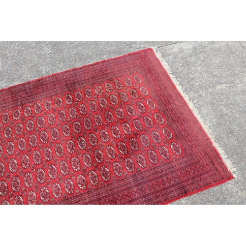 221 - Large fine handknotted wool red ground carpet, approx 352cm x 276cm