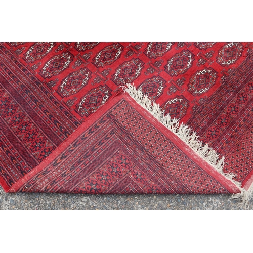 221 - Large fine handknotted wool red ground carpet, approx 352cm x 276cm