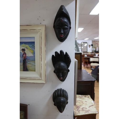 229 - Three early 20th century tribal masks from Gabon, approx 39cm x 20cm and smaller (3)