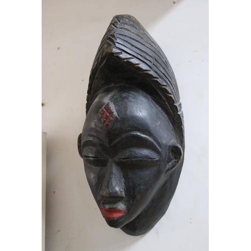 229 - Three early 20th century tribal masks from Gabon, approx 39cm x 20cm and smaller (3)