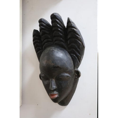 229 - Three early 20th century tribal masks from Gabon, approx 39cm x 20cm and smaller (3)