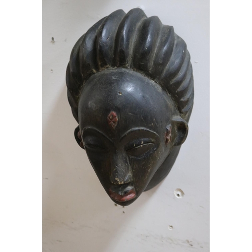 229 - Three early 20th century tribal masks from Gabon, approx 39cm x 20cm and smaller (3)