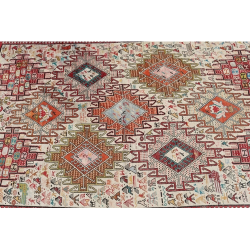 234 - Handwoven wool carpet, multi coloured, geometric design, with birds and animals, approx 190cm x 119c... 