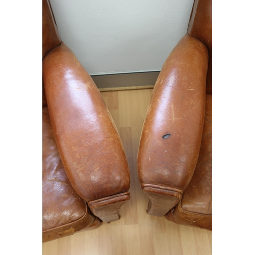 238 - Pair of original French Art Deco leather tub armchairs, showing signs of a cigarette burn hole (2)