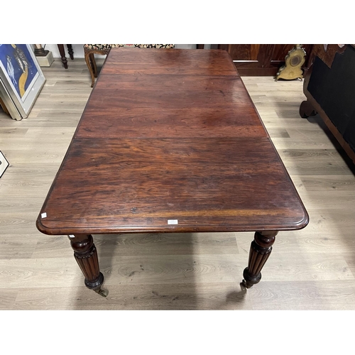 695 - Antique Victorian mahogany extension dining table, single large extra leaf standing on turned fluted... 