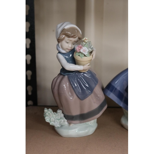 18 - Three Lladro figures girls with baskets of flowers, approx 17cm H and shorter (3)