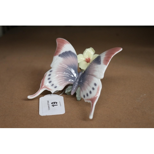 19 - Lladro porcelain butterfly on a branch, approx 6cm H x 9cm L