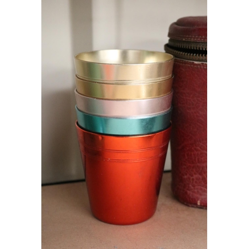 21 - Leather cased set of five Australian anodized beakers, by stokes of Melbourne. (5)