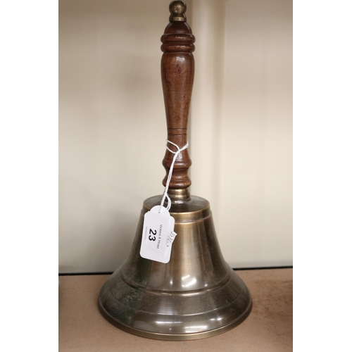 23 - Cast brass hand bell, turned wood handle, approx 26cm H