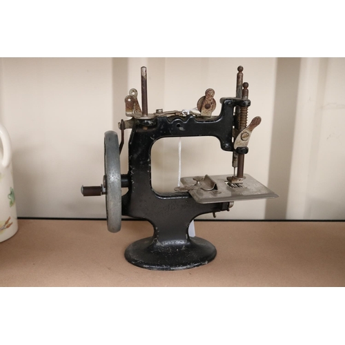 26 - Peter Pan sewing machine, approx 18cm H x 17cm W